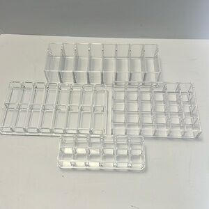4 Lucite makeup organizers. Excellent condition